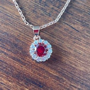 Costume jewelry red stone necklace (rose gold look) with diamanté surround